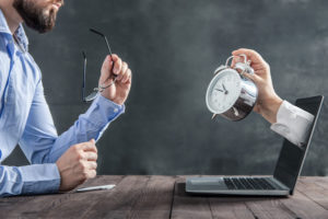 man working against time on a computer