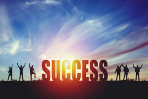 picture of Success sign with people jumping in joy