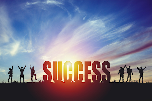 picture of Success sign with people jumping in joy