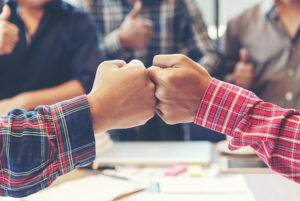 Businessman and engineer working hands of business people join hand together.