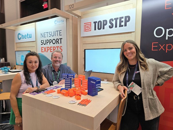 Top Step team at booth in expo hall